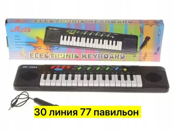 Игрушка-синтезатор из пластика с микрофоном, работает на батарейках — фото 8