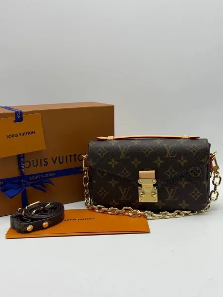Сумка из натуральной кожи и канвы с дизайном Louis Vuitton — фото 1