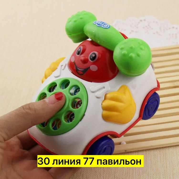 Игрушка из пластика с заводным механизмом и вращающимся циферблатом — фото 3