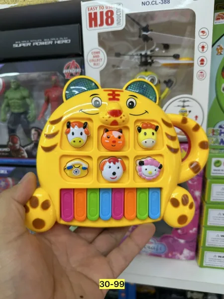 Игрушечное пианино в форме тигрёнка из пластика — фото 12
